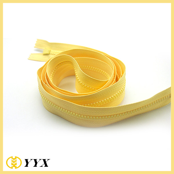 Cheap garment zipper yellow color plastic zippers large roll custom resin zipper