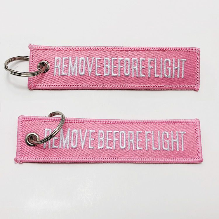 Double sided remove before flight tag custom embroidered keychain
